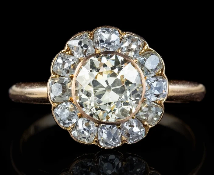 A Victorian 18-karat yellow-gold antique engagement ring with an old mine-cut diamond