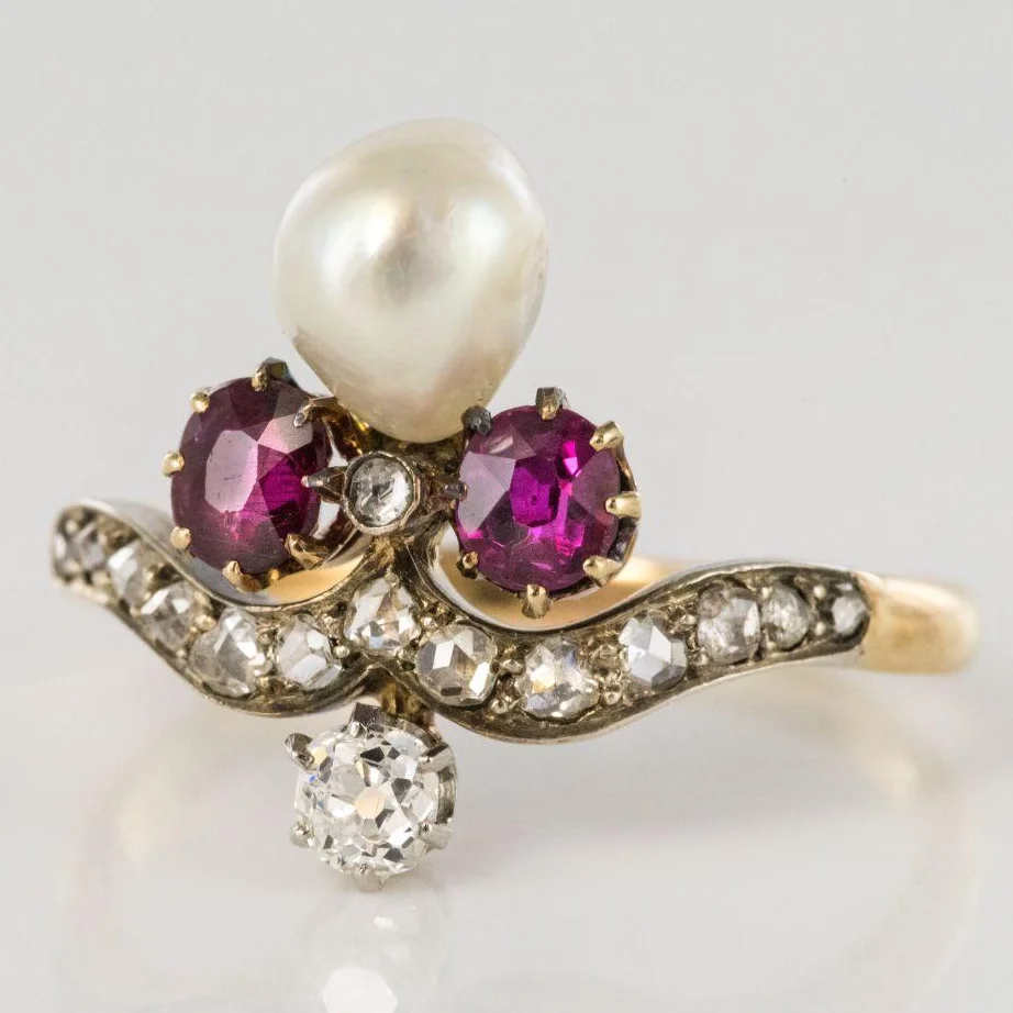 A Napoleon III 18-karat yellow-gold antique engagement ring featuring a natural baroque pearl