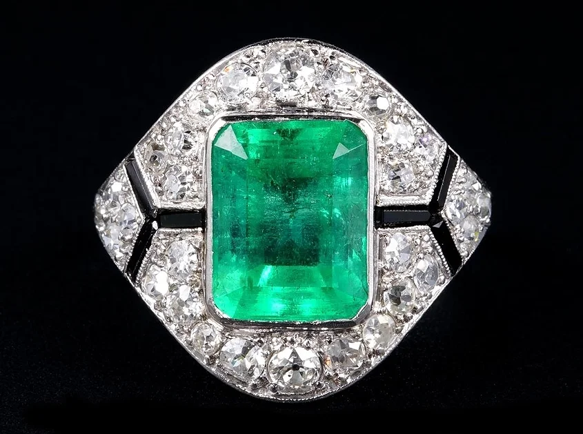 Art Deco Columbian emerald, diamond, and onyx engagement ring, offered by hakwantiques.