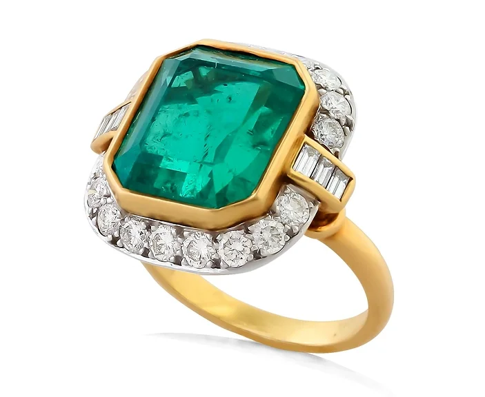 Columbian emerald, diamond, and gold engagement ring.